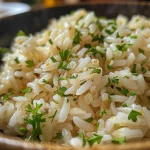 Juicy, perfectly cooked Arroz Básico in a rustic bowl.