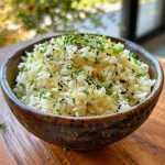 Close-up of a vibrant vegan Basmati rice dish with corn, viewed from the side.