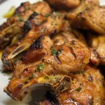 Close-up of shredded chicken with barbecue sauce.