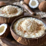 Close-up of a creamy Pudim de Coco with a caramel topping.