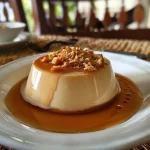 ['Mousse de Caramelo Salgado com Chantilly e nozes pecan.', 'Close-up de mousse cremosa de caramelo salgado enfeitada com chantilly.', 'Mousse de Caramelo Salgado vista lateral, coberta com natas e nozes.', 'Deliciosa mousse de caramelo salgado com toque de flor de sal e chantilly.']